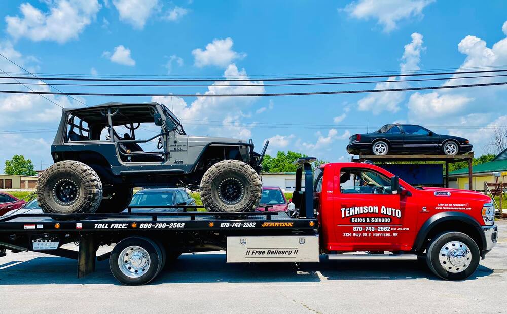 Tennison flatbed truck with Jeep on the back